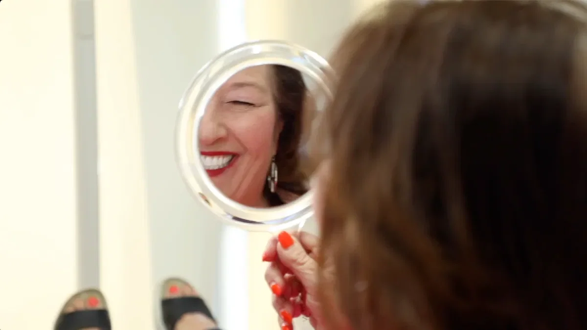 Long-term dental implant patient showing beautiful smile at Fusion Dental Implants