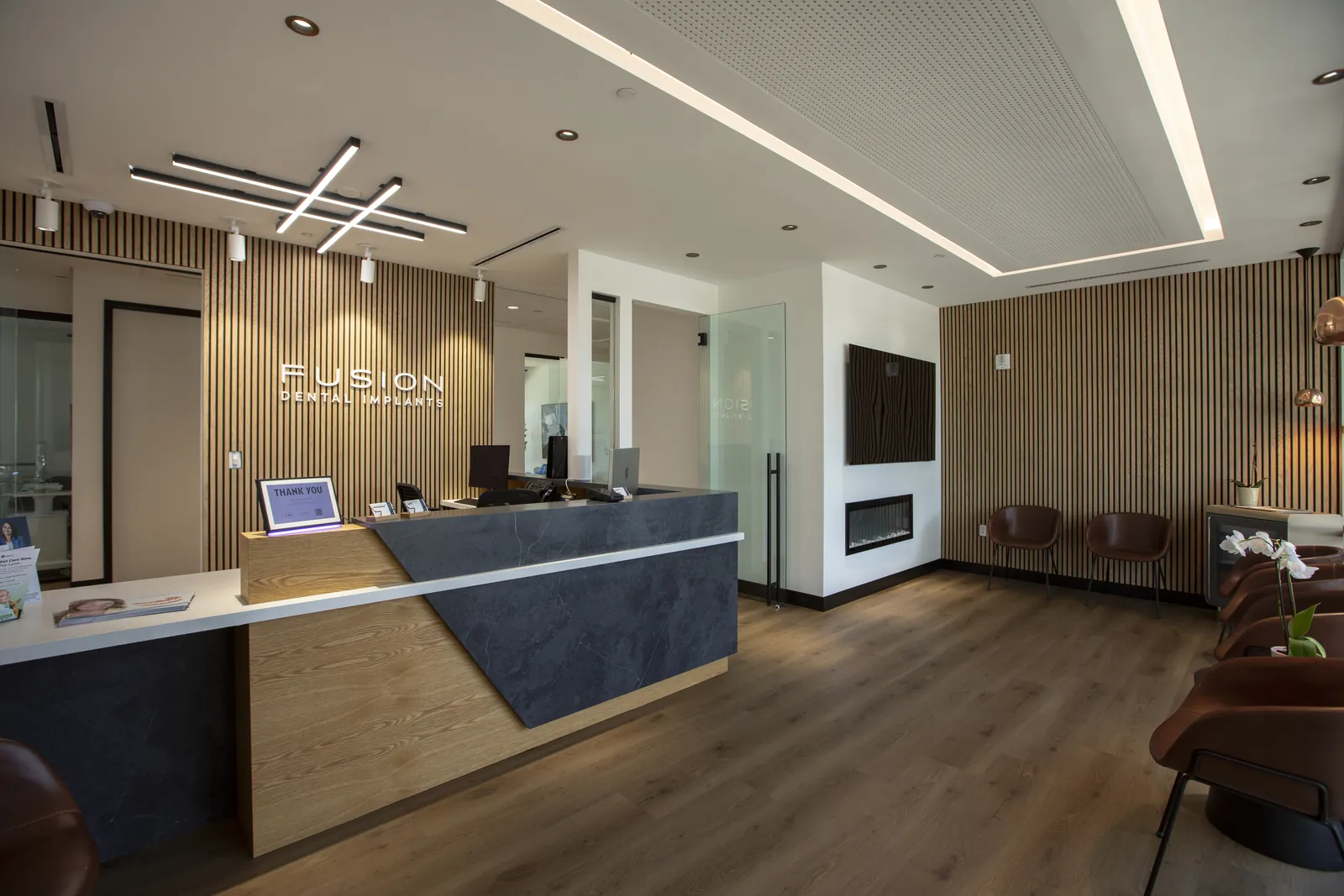 Wide view of the Fusion Dental Implants reception and seating area